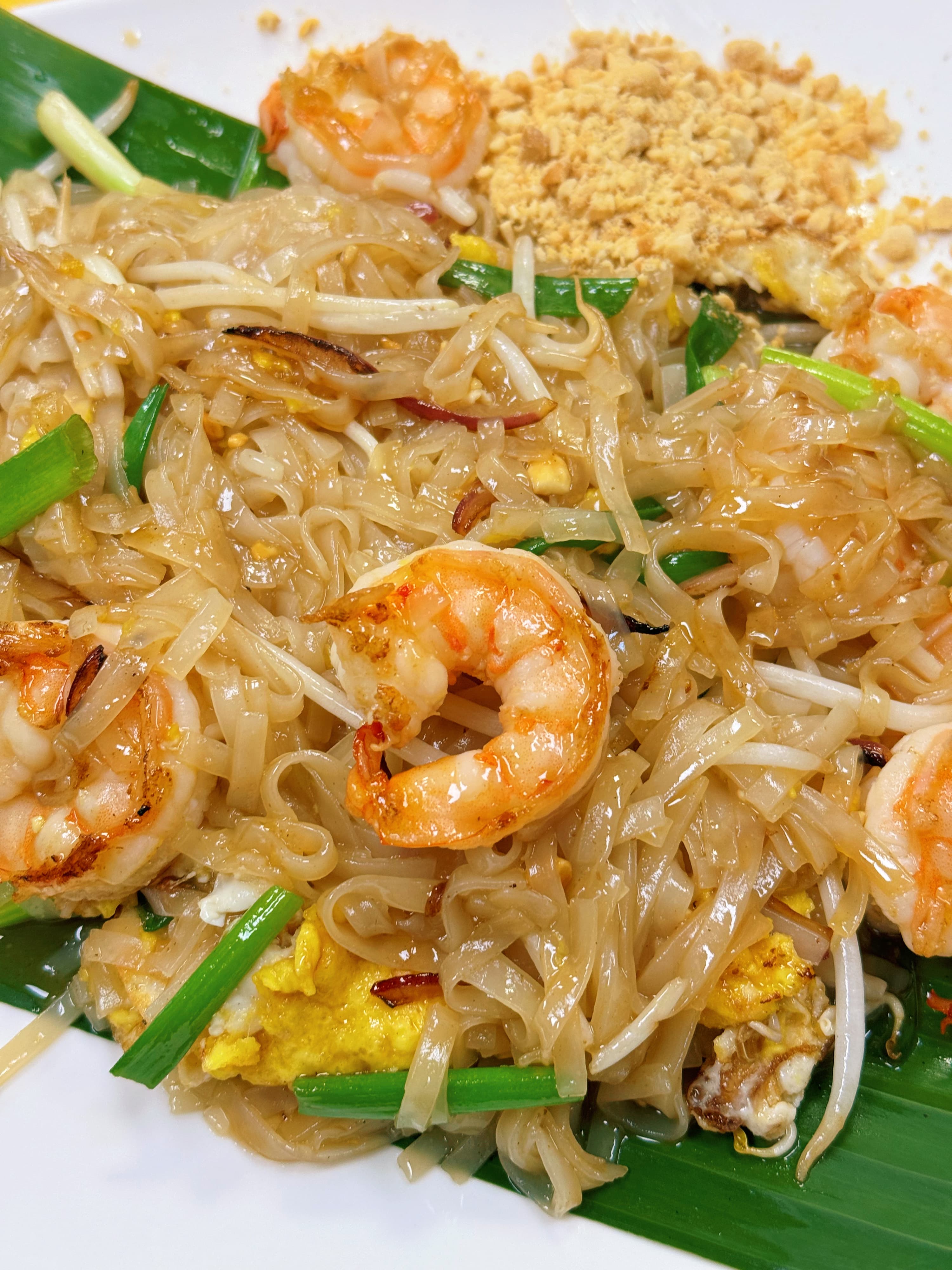 Delicious Thai cuisine with colorful dishes including pad thai, curry, and fresh vegetables